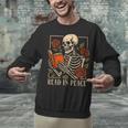 Read In Peace Skeleton Reading Book Halloween Teacher Unisex Sweatshirt Read In Peace Skeleton Reading Book Halloween Teacher Unisex Sweatshirt
