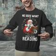 He Sees What You'Ve Been Reading Santa Book Lover Unisex Sweatshirt