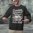 Somewhere Between a Book And a Nap – Cozy Reading Unisex Sweatshirt Somewhere Between a Book And a Nap – Cozy Reading Unisex Sweatshirt