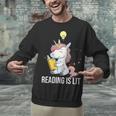 Women's Reading Is Lit Unicorn Library English Teacher Book Lover Unisex Sweatshirt Women's Reading Is Lit Unicorn Library English Teacher Book Lover Unisex Sweatshirt