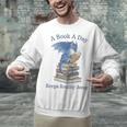 A Book A Day Keeps Reality Away Premium Tri-Blend Unisex Sweatshirt