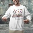 a New Chapter Begins Retired 2025 Floral Book Retirement Unisex Sweatshirt a New Chapter Begins Retired 2025 Floral Book Retirement Unisex Sweatshirt