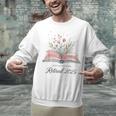 Quote New Chapter Begins Retired 2025 Floral Open Book Unisex Sweatshirt Quote New Chapter Begins Retired 2025 Floral Open Book Unisex Sweatshirt