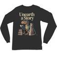 Women's Unearth A Story Dinosaur Reading a Library Book Unisex Long Sleeve T-Shirt Women's Unearth A Story Dinosaur Reading a Library Book Unisex Long Sleeve T-Shirt