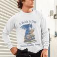 A Book A Day Keeps Reality Away Premium Tri-Blend Unisex Long Sleeve T-Shirt
