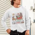Book Lovers Winter Sleighing Through Stories Tee Premium Tri-Blend Unisex Long Sleeve T-Shirt