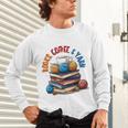 “Books Coffee & Yarn Enthusiast Cozy Reader Unisex Long Sleeve T-Shirt