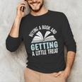 Buying A Book And Getting A Little Treat Unisex Long Sleeve T-Shirt Buying A Book And Getting A Little Treat Unisex Long Sleeve T-Shirt