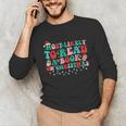 Groovy Christmas Most Likely To Read A Book On Christmas Unisex Long Sleeve T-Shirt Groovy Christmas Most Likely To Read A Book On Christmas Unisex Long Sleeve T-Shirt