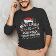 Most Likely To Read A Book Through Christmas Xmas Unisex Long Sleeve T-Shirt Most Likely To Read A Book Through Christmas Xmas Unisex Long Sleeve T-Shirt