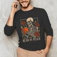 Read In Peace Skeleton Reading Book Halloween Teacher Unisex Long Sleeve T-Shirt