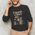 Women's Unearth A Story Dinosaur Reading a Library Book Unisex Long Sleeve T-Shirt Women's Unearth A Story Dinosaur Reading a Library Book Unisex Long Sleeve T-Shirt