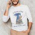 A Book A Day Keeps Reality Away Premium Tri-Blend Unisex Long Sleeve T-Shirt