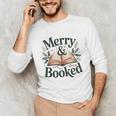 Merry And Booked Holiday Reading Winter Book Lover Premium Tri-Blend Unisex Long Sleeve T-Shirt