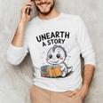 Unearth a Story Cute Dinosaur Summer Reading 2026 Dino Book Unisex Long Sleeve T-Shirt