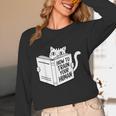 Cat Book Humor How To Train Your Human Unisex Long Sleeve T-Shirt Cat Book Humor How To Train Your Human Unisex Long Sleeve T-Shirt