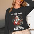 He Sees What You'Ve Been Reading Santa Book Lover Unisex Long Sleeve T-Shirt He Sees What You'Ve Been Reading Santa Book Lover Unisex Long Sleeve T-Shirt