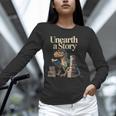Unearth A Story Dinosaur Reading a Library Book Unisex Long Sleeve T-Shirt Unearth A Story Dinosaur Reading a Library Book Unisex Long Sleeve T-Shirt
