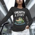 Unearth a Story Frog Reading a Book Summer 2026 Unisex Long Sleeve T-Shirt