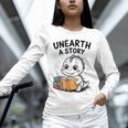Unearth a Story Cute Dinosaur Summer Reading 2026 Dino Book Unisex Long Sleeve T-Shirt