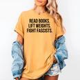 Read Books Lift Weights Fight Fascists Premium Tri-Blend Women's Comfort Colors T-Shirt Mustard Read Books Lift Weights Fight Fascists Premium Tri-Blend Women's Comfort Colors T-Shirt Mustard