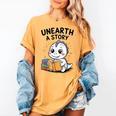 Unearth a Story Cute Dinosaur Summer Reading 2026 Dino Book Women's Comfort Colors T-Shirt Mustard Unearth a Story Cute Dinosaur Summer Reading 2026 Dino Book Women's Comfort Colors T-Shirt Mustard