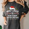 Most Likely To Read A Book Through Christmas Xmas Women's Comfort Colors T-Shirt Pepper