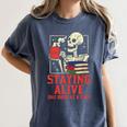 Staying Alive One Book At A Time Skeleton Reading Librarian Women's Comfort Colors T-Shirt Moss