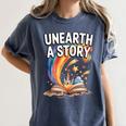 Unearth A Story Rainbow Treasure Book Women's Comfort Colors T-Shirt Moss