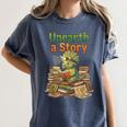 Unearth a Story Triceratops Dinosaur Reading Books Cute Dino Women's Comfort Colors T-Shirt Moss