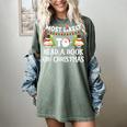 Most Likely To Read A Book On Christmas Snowman Family Women's Comfort Colors T-Shirt Berry