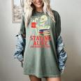 Staying Alive One Book At A Time Skeleton Reading Librarian Women's Comfort Colors T-Shirt Berry