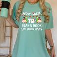 Most Likely To Read A Book On Christmas Snowman Family Women's Comfort Colors T-Shirt Violet
