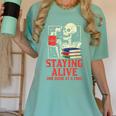 Staying Alive One Book At A Time Skeleton Reading Librarian Women's Comfort Colors T-Shirt Violet