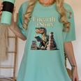 Unearth A Story Dinosaur Reading a Library Book Women's Comfort Colors T-Shirt Violet