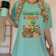 Unearth a Story Triceratops Dinosaur Reading Books Cute Dino Women's Comfort Colors T-Shirt Violet