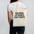 Read Books Lift Weights Fight Fascists Premium Tri-Blend Canvas Tote Bag Read Books Lift Weights Fight Fascists Premium Tri-Blend Canvas Tote Bag