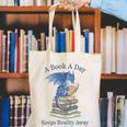 A Book A Day Keeps Reality Away Premium Tri-Blend Canvas Tote Bag