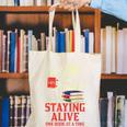 Staying Alive One Book At A Time Skeleton Reading Librarian Canvas Tote Bag