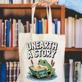 Unearth a Story Frog Reading a Book Summer 2026 Premium Tri-Blend Canvas Tote Bag Unearth a Story Frog Reading a Book Summer 2026 Premium Tri-Blend Canvas Tote Bag