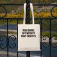 Read Books Lift Weights Fight Fascists Premium Tri-Blend Canvas Tote Bag Read Books Lift Weights Fight Fascists Premium Tri-Blend Canvas Tote Bag