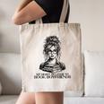 Book Lover Bent Over a Book Canvas Tote Bag