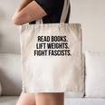 Read Books Lift Weights Fight Fascists Premium Tri-Blend Canvas Tote Bag Read Books Lift Weights Fight Fascists Premium Tri-Blend Canvas Tote Bag