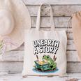 Unearth a Story Frog Reading a Book Summer 2026 Premium Tri-Blend Canvas Tote Bag Unearth a Story Frog Reading a Book Summer 2026 Premium Tri-Blend Canvas Tote Bag