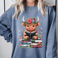 Bookworm Cute Baby Highland Cow Reading Book Comfort Colors Sweatshirt Denim Bookworm Cute Baby Highland Cow Reading Book Comfort Colors Sweatshirt Denim