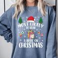 Christmas Tee Most Likely To Read A Book On Christmas Comfort Colors Sweatshirt Denim Christmas Tee Most Likely To Read A Book On Christmas Comfort Colors Sweatshirt Denim