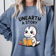 Unearth a Story Cute Dinosaur Summer Reading 2026 Dino Book Comfort Colors Sweatshirt Denim Unearth a Story Cute Dinosaur Summer Reading 2026 Dino Book Comfort Colors Sweatshirt Denim