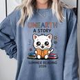 Unearth a Story Cute Kitten Summer Reading 2026 Cat Book Comfort Colors Sweatshirt Denim Unearth a Story Cute Kitten Summer Reading 2026 Cat Book Comfort Colors Sweatshirt Denim