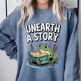 Unearth a Story Frog Reading a Book Summer 2026 Comfort Colors Sweatshirt Denim Unearth a Story Frog Reading a Book Summer 2026 Comfort Colors Sweatshirt Denim