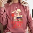 Staying Alive One Book At A Time Skeleton Reading Librarian Comfort Colors Sweatshirt Orchid
